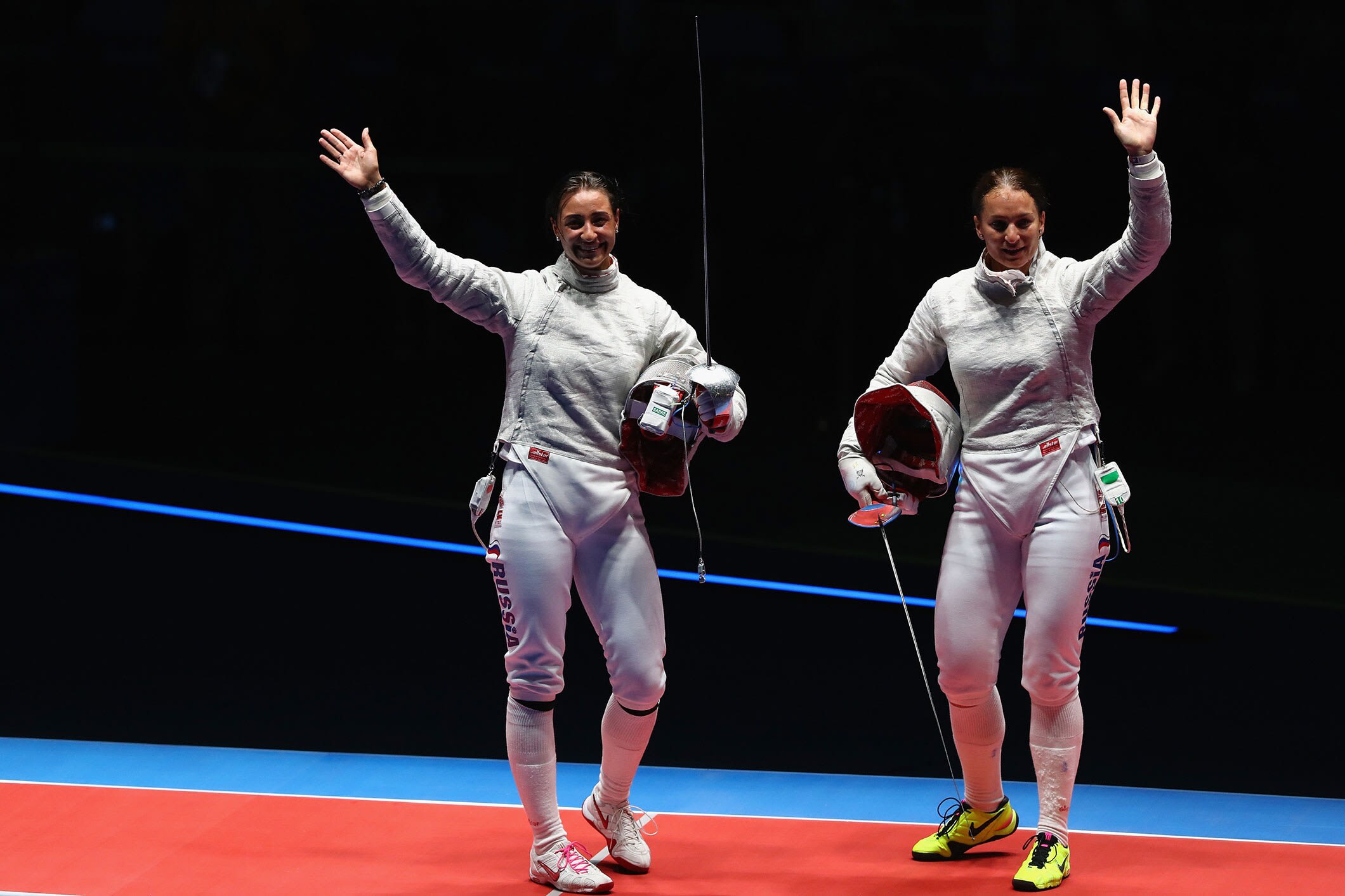 Sofya Velikaya of Russia  and Yana Egorian of Russia look on following the Women's Individual Sabre Gold Medal Bout on Day 3 of the Rio 2016 Olympic Games at Carioca Arena 3 on August 8, 2016 in Rio de Janeiro, Brazil