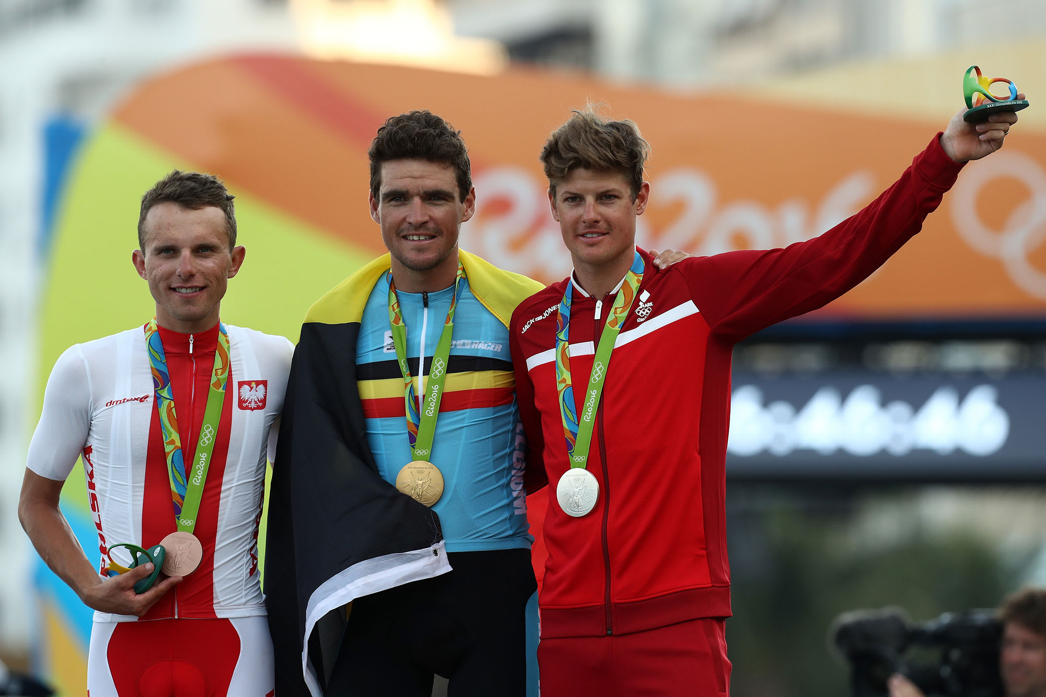  Silver medalist Jakob Fuglsang of Denmark, Gold medalist Greg van Avermaet of Belgium and bronze medalist Rafal Majka of Poland celebrate on the podium at the medal ceremony for the Men's Road Race on Day 1 of the Rio 2016 Olympic Games at the Fort Copacabana on August 6, 2016 in Rio de Janeiro, Brazil
