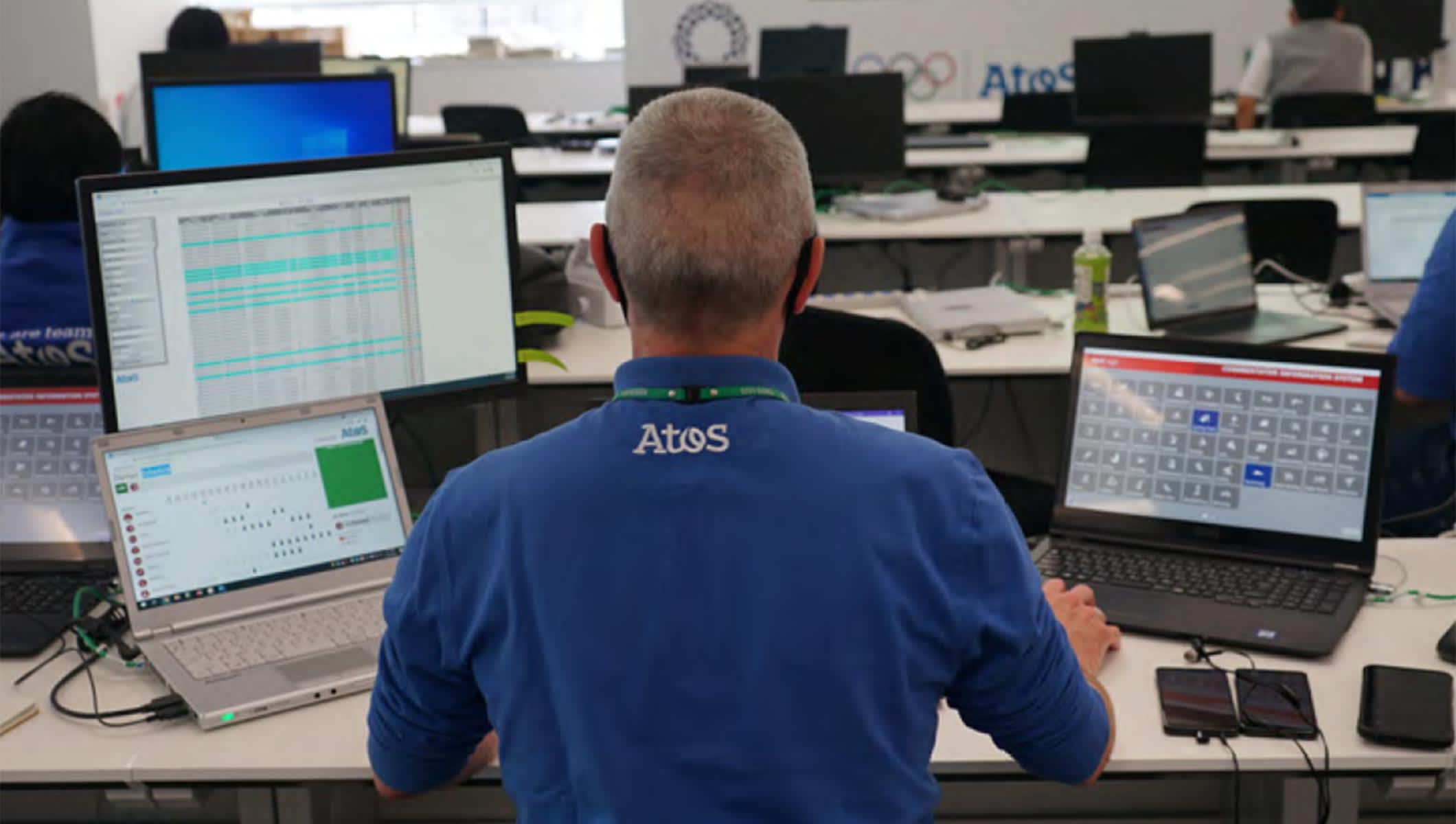 Olympic staff member working with Atos technology solutions