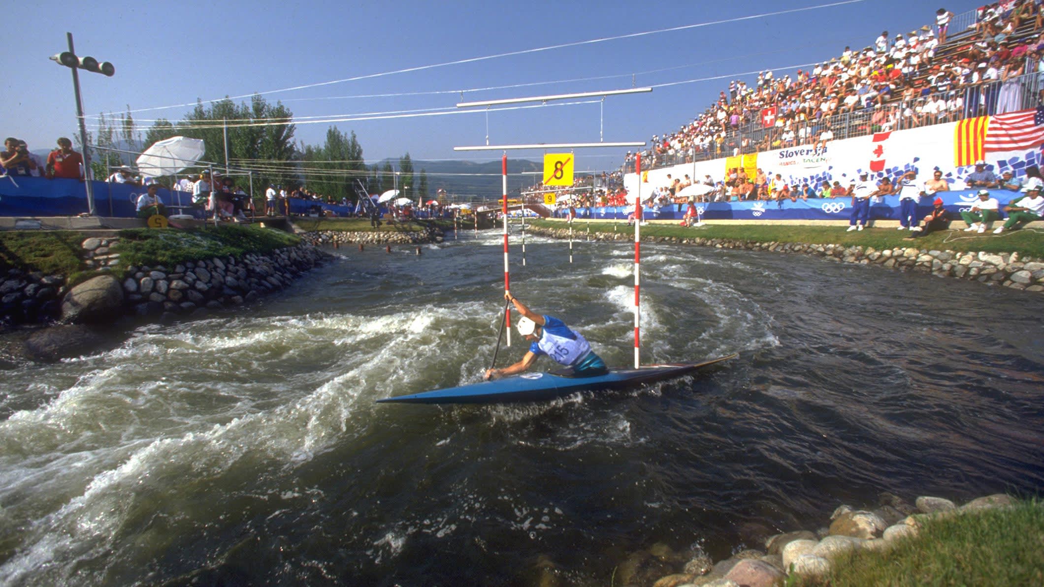 Lukas Pollert of czechoslovakia maneuvers through a gate during the c1 canoeing white water slalom competition at the 1992 Barcelona Olympics
