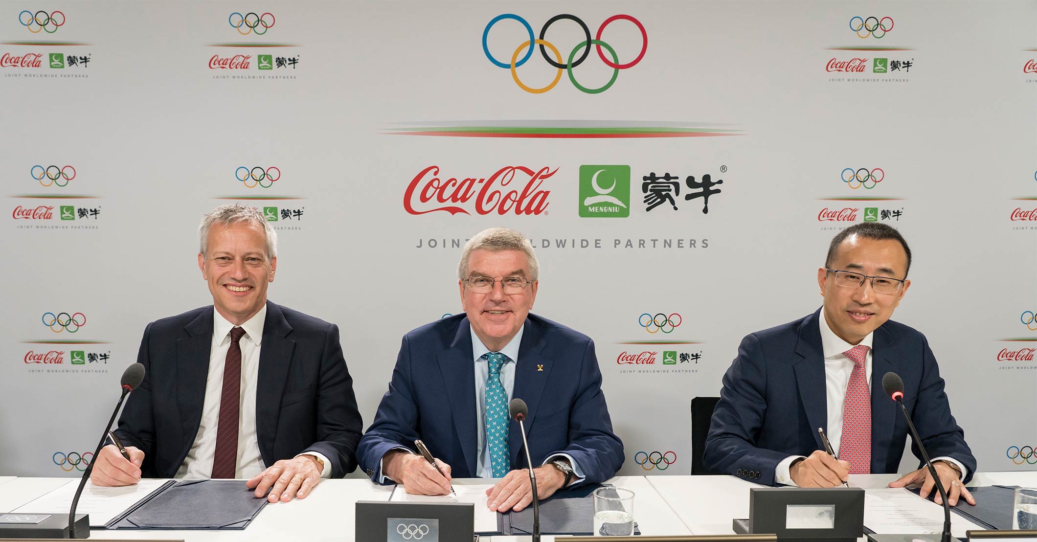 James Quincey, Chairman and CEO of The Coca-Cola Company - IOC President Thomas Bach - Jeffrey Lu, CEO and Executive Director of Mengniu (IOC/Greg Martin)