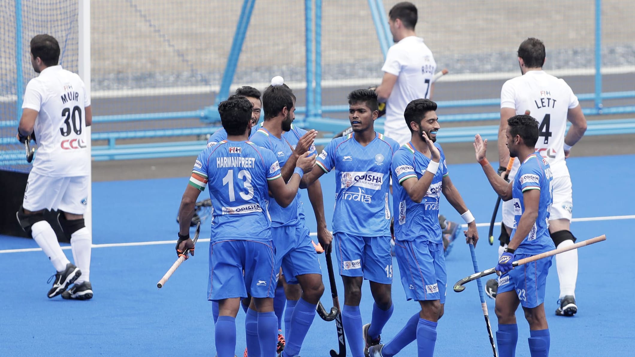Getty Images "Shamsher Singh (2nd r) celebrates after putting India 2-0 up against New Zealand"