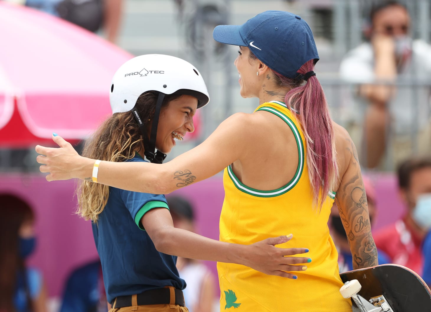 Bufoni and Leal embrace during the women's street prelims at the Tokyo 2020 Olympics