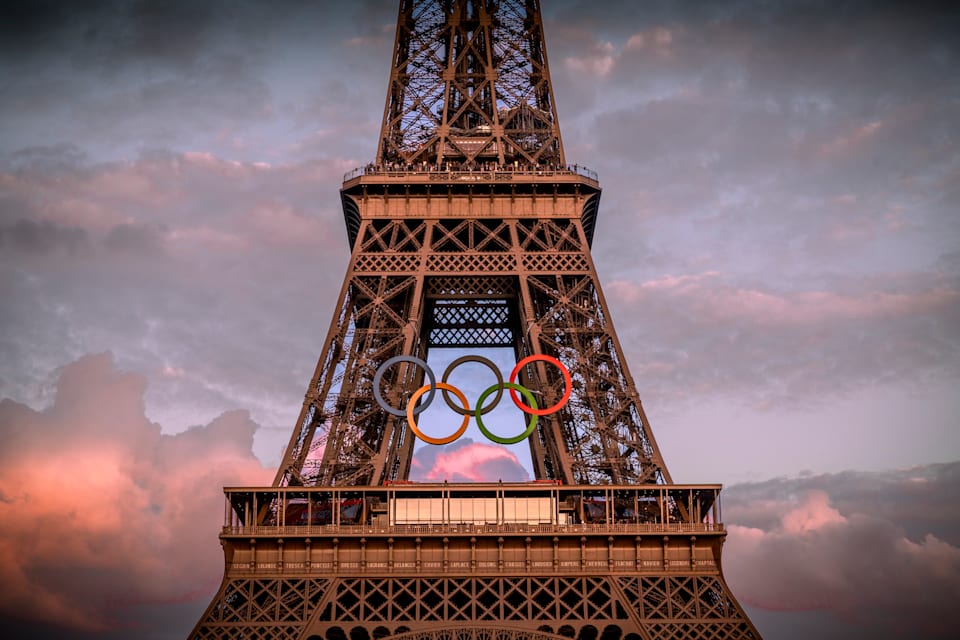 PARIS, FRANCE - JUNE 12: The Olympic rings are seen on the Eiffel Tower ahead of the start of the Paris 2024 Olympic Games on June 12, 2024 in Paris, France. The 2024 Summer Olympic Games begin on July 26. (Photo by Kiran Ridley/Getty Images)