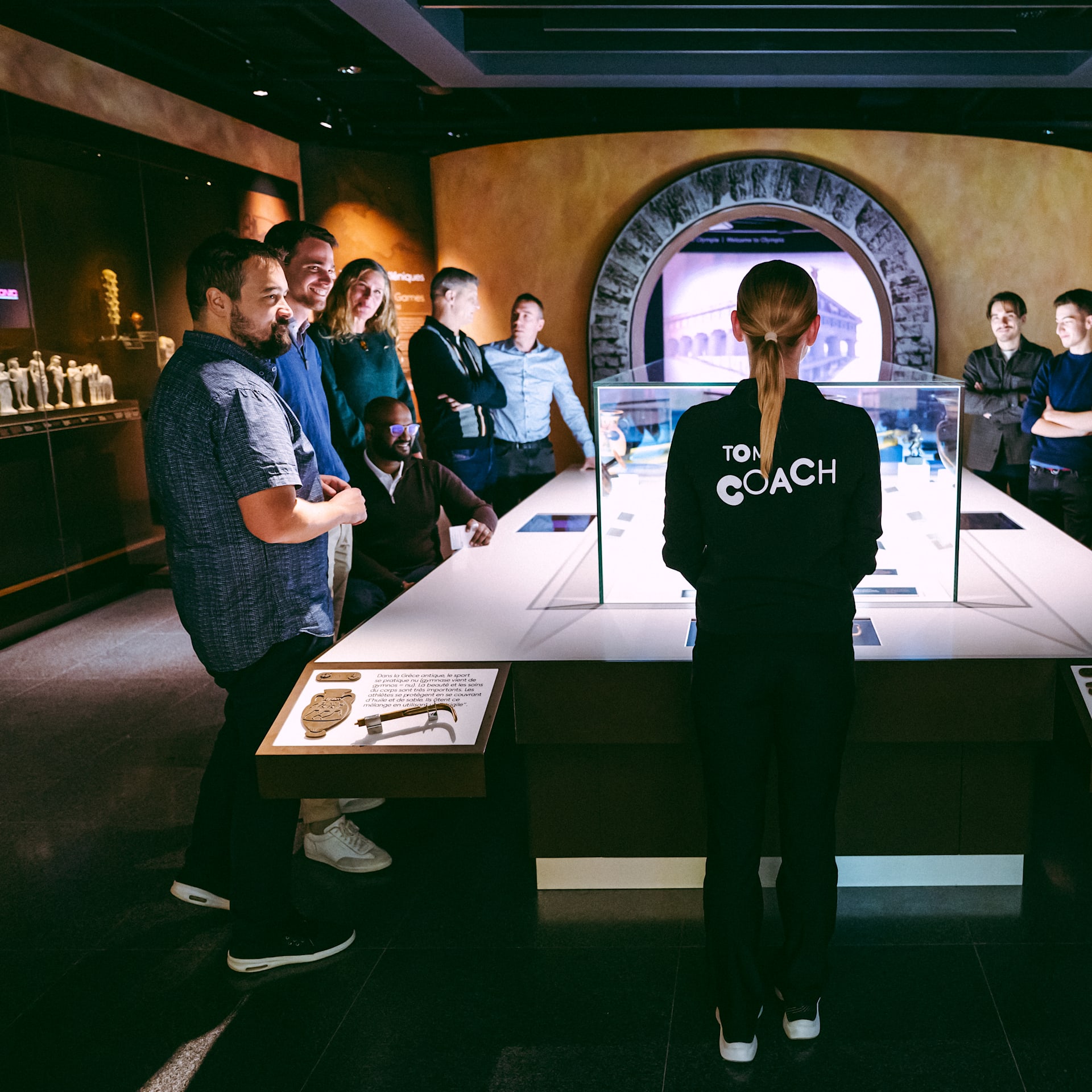 Coach giving a guided tour in the Permanent Exhibition