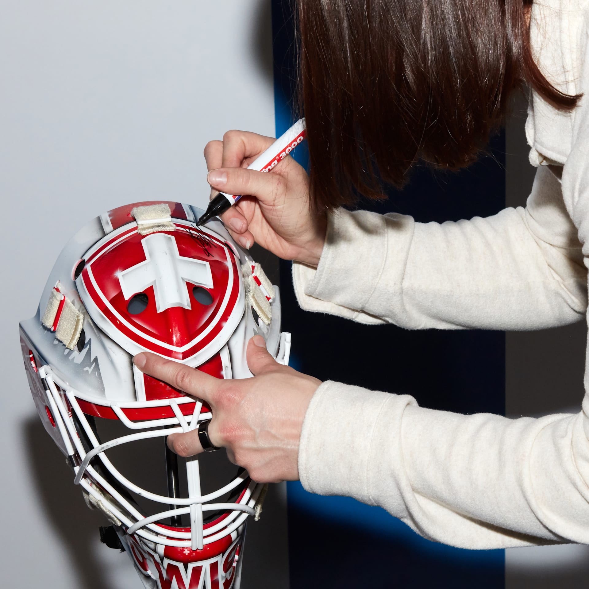 Olympian signing her equipment