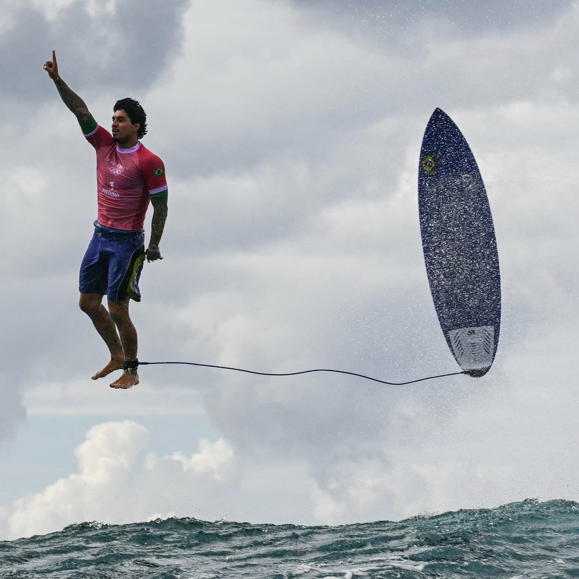 TOPSHOT - Brazil's Gabriel Medina reacts after getting a large wave in the 5th heat of the men's surfing round 3, during the Paris 2024 Olympic Games, in Teahupo'o, on the French Polynesian Island of Tahiti, on July 29, 2024. (Photo by Jerome BROUILLET / AFP) / ALTERNATE CROP (Photo by JEROME BROUILLET/AFP via Getty Images)