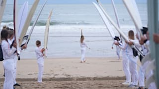 Surfing during the Stage 12 of the Olympic Torch Relay in the Pyrénées-Atlantiques