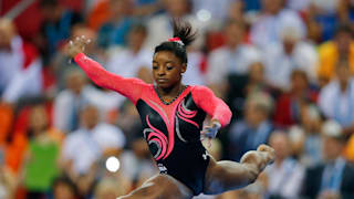 Simone Biles leaps on beam during the apparatus final at the 2014 Worlds