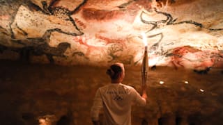 The Olympic Torch visiting the Lascaux cave during the stage 13