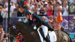 Charlotte Dujardin hugs her horse Valegro, celebrating with her gold medal during the medal ceremony following the Individual Dressage on Day 13 of the London 2012 Olympic Games.