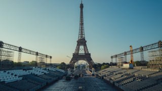 View of the Olympic rings on the Eiffel Tower from Stade Tour Eiffel, the future Beach volley Olympic venue