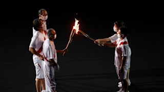 The Olympic Flame is carried into the stadium during the Opening Ceremony of the Tokyo 2020 Olympic Games at Olympic Stadium on July 23, 2021 in Tokyo, Japan. Photo by Ezra ShawGetty Images.