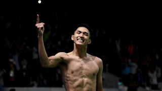 A shirtless Jonatan Christie celebrates victory winning gold at 2018 Asian Games. (Photo by Robertus Pudyanto/Getty Images)