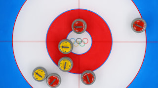 A view of curling stones on the sheet at the National Aquatics Centre 