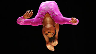 Simone Biles flips during the beam final at the 2015 Worlds