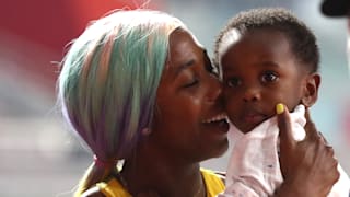 Shelly-Ann Fraser-Pryce of Jamaica celebrates with her son Zyon after winning the Women's 100 Metres final during day three of 17th IAAF World Athletics Championships Doha 2019 at Khalifa International Stadium on September 29, 2019 in Doha, Qatar. (Photo by Alexander Hassenstein/Getty Images for IAAF)