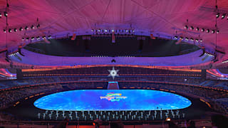 General view of the stadium with performers on the stage and the Beijing 2022 logo, at the beginning of the Closing Ceremony
