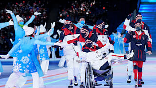 The USA team high five with the performers during the opening ceremony of the Beijing 2022 Winter Paralympic Games