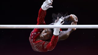 Simone Biles performs on the uneven bars during the team final at the 2018 Worlds