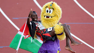 Conseslus Kipruto of Kenya is carried by mascot, Legend, after winning bronze in the Men's 3000m Steeplechase at the World Athletics Championships Oregon22. (Photo by Carmen Mandato/Getty Images)