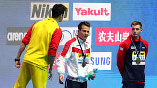 Sun Yang (L) of China yells at Duncan Scott (R) of Great Britain during the medal ceremony for the Men's 200m Freestyle Final on day three of the Gwangju 2019 FINA World Championships at Nambu International Aquatics Centre on July 23, 2019 in Gwangju, South Korea. (Photo by Catherine Ivill/Getty Images)