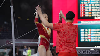Chen Yile celebrates with her coach after uneven bars at the 2019 World Championships (Photo: Olympic Channel)