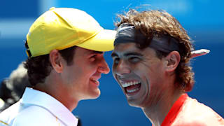 Rafael Nadal of Spain and Roger Federer of Switzerland enjoy the day during the Rally For Relief charity exhibition match ahead of the 2011 Australian Open