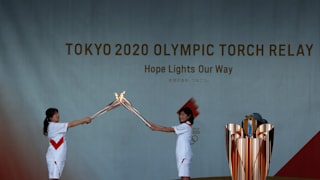 Tokyo 2020 Olympic torch bearers change over nest to cauldron during day one of the Tokyo Olympic Torch Relay Hyogo at Himeji Castle on May 23, 2021 in Himeji, Hyogo, Japan.