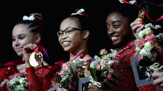 Ragan Smith (left), Morgan Hurd (center) and Simone Biles (right) smile after winning team gold at the 2018 Worlds