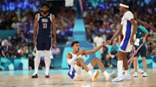 A shoe belonging to Victor Wembanyama sits on the court during the Men's Gold Medal game between Team France and Team United States