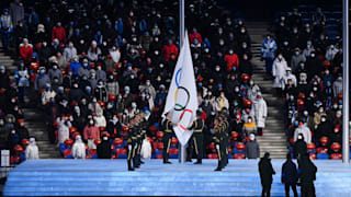 The flag of the IOC is hoisted during the Beijing 2022 Winter Olympics Closing Ceremony