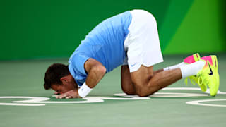 Juan Martin  kisses the court after defeating Rafael Nadal of Spain in the Men's Singles Semifinal Match on Day 8 of the Rio 2016 Olympic Games.