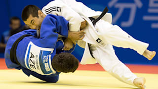Bauyrzhan Zhauyntayev of Kazakhstan competes with Natig Gurbanli of Azerbaijan during Men -55 kg Judo