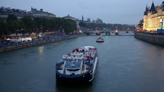 Team Netherlands and Team Peru are seen on a boat along the River Seine near the Supreme Court