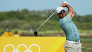 Jaco van Zyl of South Africa watches his tee shot on the ninth hole during the third round of the golf on Day 8 of the Rio 2016 Olympic Games.