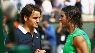 Rafael Nadal of Spain shakes hands with Roger Federer (L) of Switzerland, followinghis victory during the Men's Singles Final match on day fifteen of the French Open at Roland Garros 2005