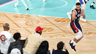 Stephen Curry points to the crowd after a three-point basket