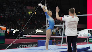Angelina Melnikova celebrates with a coach at the 2019 World Championships (Photo: Olympic Channel)
