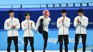 Kwak Yoongy kicks to complete his 'Dynamite' dance during the men's short track 5000m relay victory ceremony