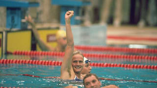 Kristin Otto of East Germany punches the air after  winning the 100 Metres Freestyle event