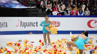 Winnie the Pooh soft toys on the ice after Yuzuru Hanyu's free skate
