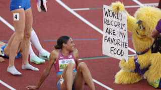 Sydney McLaughlin of USA celebrates with Legend the mascot after winning gold and setting a new world record in the Women's 400m Hurdles at the World Athletics Championships Oregon22. (Photo by Patrick Smith/Getty Images)