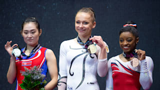 Hong Un-Jong (left), Maria Paseka (middle) and Simone Biles (right) share the vault podium in 2015 (John Cheng/USA Gymnastics)