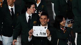 Damien Hooper of Australia displays the message 'I love you Nan' as he parades around the stadium with the rest of the Australia team during the Opening Ceremony of the London 2012 Olympic Games.