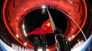 The Chinese flag is raised inside the stadium during the Opening Ceremony of the Beijing 2022 Winter Paralympics