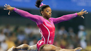 Simone Biles leaps during the all-around final at the 2014 Worlds