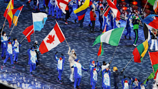 Flagbearer Isabelle Weidemann of Team Canada (c) walks in the Athletes parade 