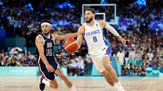 Isaia Cordinier #8 of Team France drives past Devin Booker #15 of Team United States