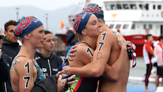 Haley Anderson (C), Michael Brinegar (R) and Ashley Twichell (L) of the United States celebrate winning bronze in the Mixed 5km Relay Final at the Gwangju 2019 FINA World Championships at Yeosu EXPO Ocean Park on July 18, 2019 in Yeosu, South Korea. (Photo by Chung Sung-Jun/Getty Images)